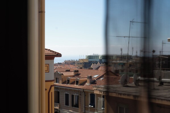 A view of a cityscape with traditional architecture and a clear sky. - Elegant Apartment in the Center by Wonderful Italy (Sanremo)