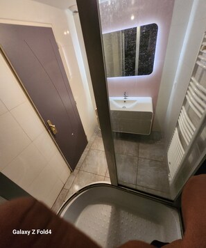 Shower, towels, soap, toilet paper