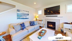 Télévision, cheminée, lecteur de DVD, vidéothèque