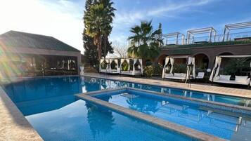 Outdoor pool, pool umbrellas, sun loungers