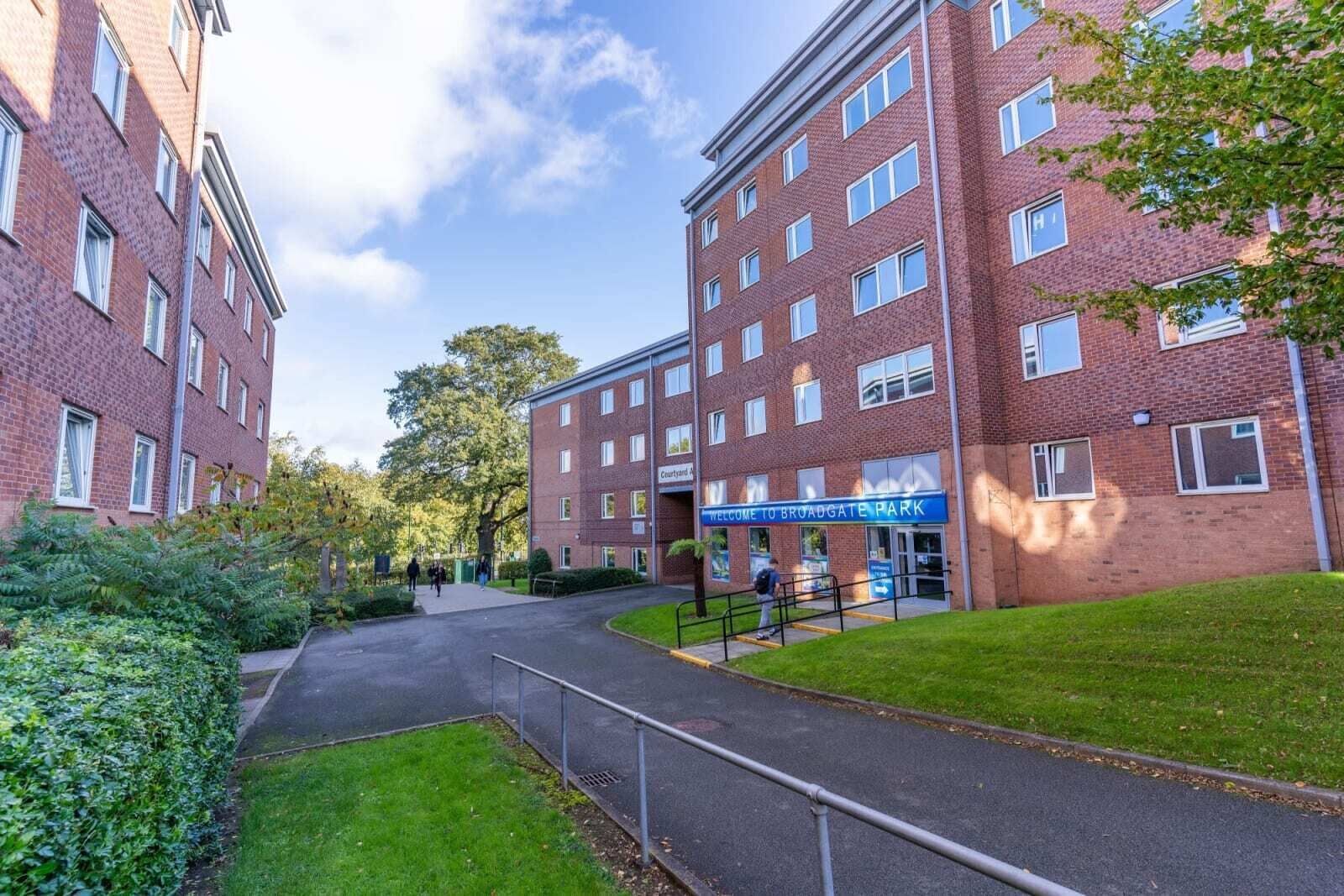 A red brick building with a sign reading "Welcome to Broadgate Park."