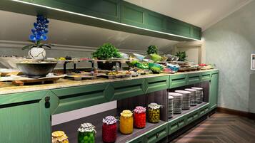 A buffet setup with various food items and condiments.