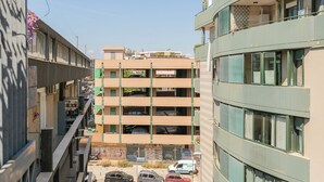 A multi-story building with a parking garage below. - Terrazza Corallo by Wonderful Italy (Bari)