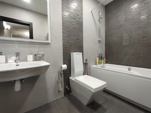 Shower, hair dryer, towels, soap