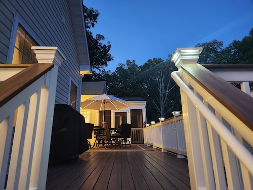 Spacious 5-bedroom house with kitchens and decks on both levels.