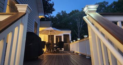 Spacious 5-bedroom house with kitchen and deck on both levels.