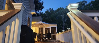 Spacious 5-bedroom house with kitchen and deck on both levels.