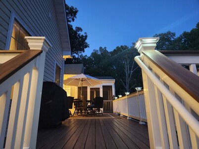 Spacious 5-bedroom house with kitchen and deck on both levels.