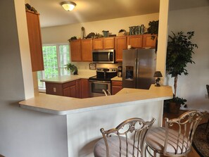 Fridge, microwave, oven, stovetop - Spacious 5-bedroom house with kitchens and decks on both levels. (Mineral)