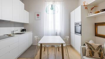 Apartment, Balcony | Living area | 35-inch TV with digital channels