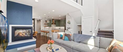 Smart TV, fireplace, books, offices