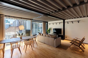 Apartment, 2 Bedrooms | Living area | 43-inch Smart TV with cable channels