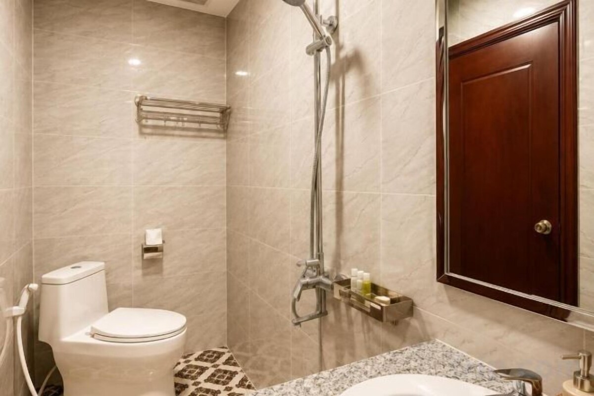 Shower, rainfall showerhead, slippers, towels