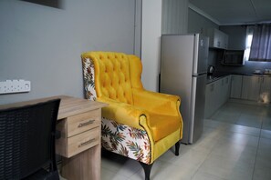 Deluxe appartement, uitzicht op tuin | Woonruimte