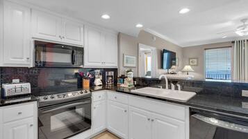 Condo, Multiple Beds, Balcony (Treasure Island 2210) | Private kitchen | Fridge, microwave, oven, stovetop