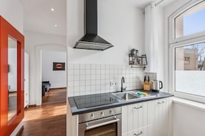 Fridge, coffee/tea maker, cookware/dishes/utensils