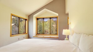 A bedroom with a large bed, two windows, and a lamp. - Beautiful Views, Awesome Amenities, 195 Eastridge (Dillon)