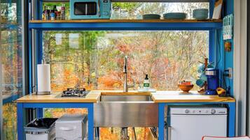 Fridge, microwave, cookware/dishes/utensils, dining tables