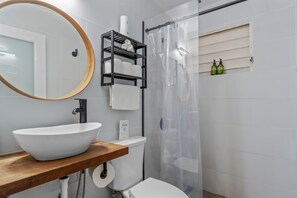 Shower, hair dryer, towels, soap