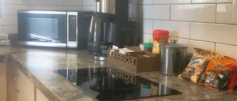 Fridge, microwave, stovetop, coffee/tea maker