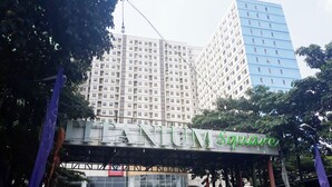 A building with a sign reading "Mansion Square" and a supermarket sign below it. - Comfortable And Tidy Studio At Titanium Square Apartment (Jakarta)