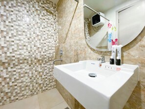 Deluxe Studio | Bathroom - Best Choice And Modern Studio At Apartment Mataram City (Ngaglik)