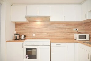 Deluxe Apartment | Private kitchen | Full-sized fridge, microwave, oven, stovetop - Good Place 2Br Apartment At Sudirman Tower Condominium (Jakarta)