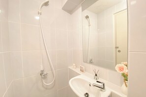 Deluxe Studio | Bathroom | Shower, towels - Good Deal And Restful Studio At Apartment Tokyo Riverside Pik 2 (Teluknaga)
