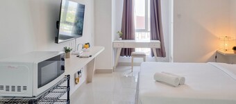 Comfortable And Homey Studio Room At Barsa City Apartment