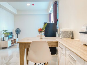 Deluxe Apartment | Private kitchen | Full-sized fridge, stovetop, electric kettle, dining tables - Homey And Spacious 2Br At Meikarta Apartment (Cikarang)