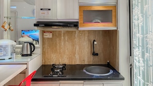 Apartment | Private kitchen | Fridge, stovetop, rice cooker, dining tables - Warm And Homey 2Br At Bassura City Apartment (Jakarta)