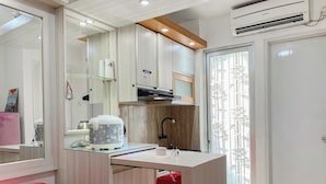 Apartment | Private kitchen | Fridge, stovetop, rice cooker, dining tables - Warm And Homey 2Br At Bassura City Apartment (Jakarta)