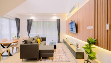 Apartamento luxo | Área de estar | TV de tela plana