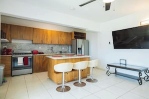 Fridge, microwave, stovetop, coffee/tea maker