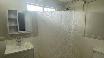 Shower, hair dryer, towels, soap