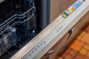 A dishwasher with a control panel and a handle. - Casa Alessandro in the Elegant Crocetta (Turin)