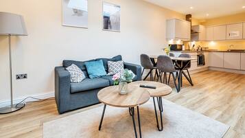Comfort Apartment, 1 Bedroom, Private Bathroom | Living area | 50-inch Smart TV with digital channels, Netflix, streaming services