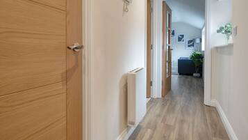 Deluxe Apartment, 1 Bedroom, Private Bathroom | Living area | 50-inch Smart TV with digital channels, Netflix, streaming services