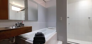 Jetted bath, hair dryer, towels, soap