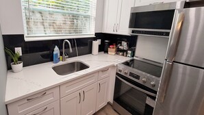 Coffee/tea maker, fridge, microwave, oven