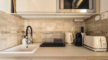 Fridge, microwave, stovetop, coffee/tea maker