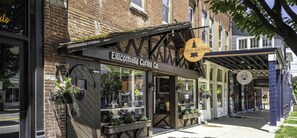 A storefront with a sign for 'Elicottville Coffee Co.' and 'Alpine Bistro.'
