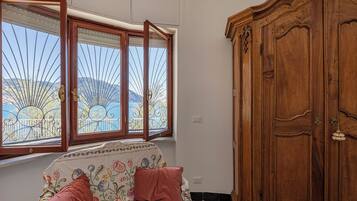 Apartment, Sea View | Living area | 35-cm TV with digital channels