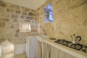 Fridge, stovetop, high chair, cookware/dishes/utensils