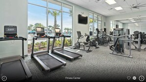 A fitness center with treadmills, exercise bikes, and weight machines. - Brand New Windsor Island 10BR Mansion/Pool/Spa (Davenport)