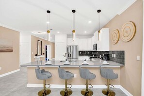 Fridge, microwave, oven, stovetop - Brand New High End 9BR Villa in Storey Lake Resort (Kissimmee)