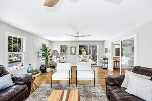 Smart TV, fireplace, books, computer monitors