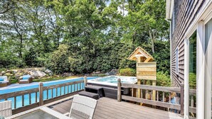 A wooden deck with a hot tub, a pool, and a wooden gazebo. - Luxury retreat, in-ground huge pool, 10-person hot tub, outdoor shower, fire pit (Barnstable)