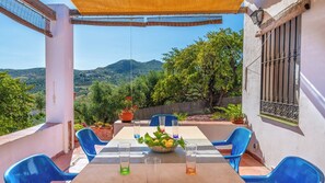 Enjoy a romantic meal for two on this outdoor terrace with a stunning mountain view.