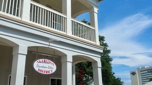 A building with a sign reading "Nutrition Downtown Biloxi District".
